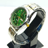 Wristwatch with green face and silver band on a black stand