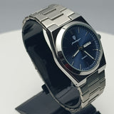 Silver watch with a blue face on a black stand against a white background