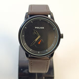 Police watch with brown leather strap on a white background